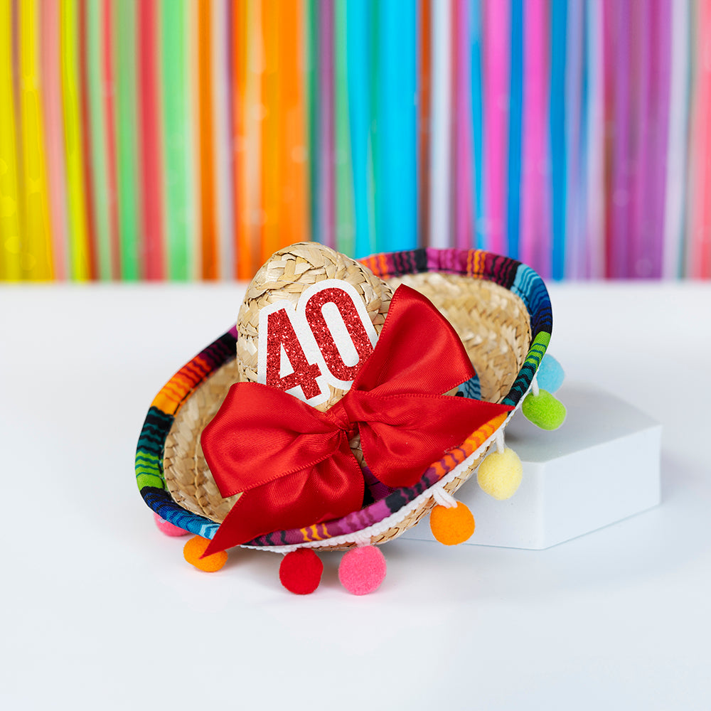 Mini multi pom sombrero with red bow and "40" red number.