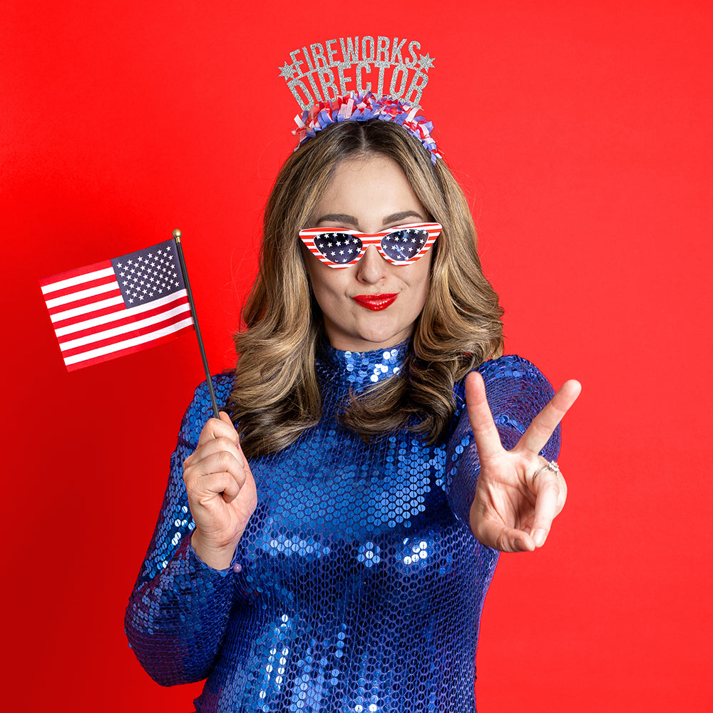 Young woman wearing 4th of July Party headband that says Fireworks Director