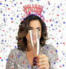 Young woman wearing 4th of July Party headband that says Raise a Glass to Freedom