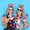 Two young women wearing 4th of July Party headband that says Red White and Boozy