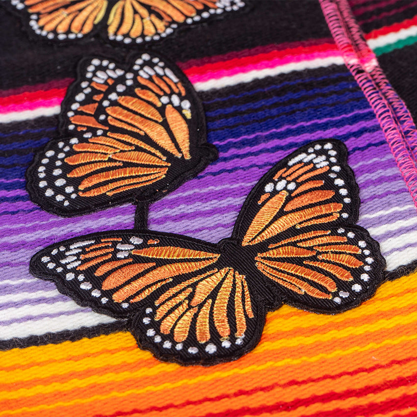 Beautiful, embroidered appliqué artwork details.