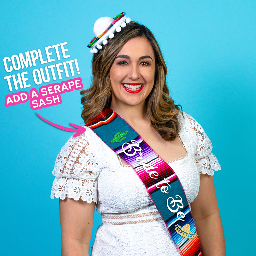 Woman wearing white mini sombrero hat and serape sash. Complete outfit with serape sash.