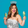 Young woman wearing New Years Eve Party headband saying Champagne Champion