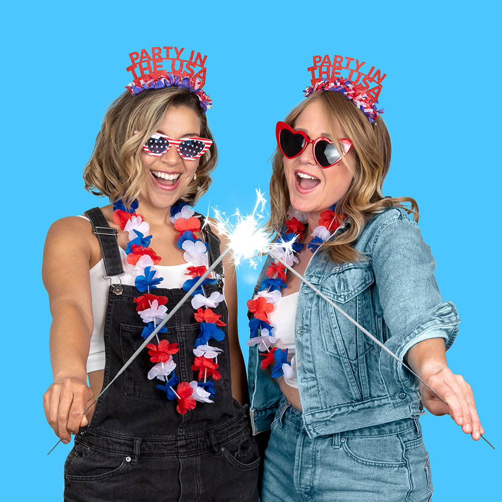 Two young girls wearing a Red White and Blue Party Crown Headband that says Party in the USA