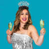 Young woman wearing New Years Eve Party headband saying Pop The Bubbly
