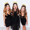Girls wearing graduation crown that says "Yay We Made It" in black and gold
